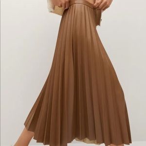 Pleated vegan leather brown skirt. Never worn. Brand- Mango